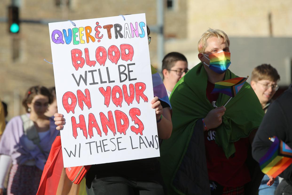 Protesters march in support of transgender rights Friday at a rally at the Statehouse in Topeka.