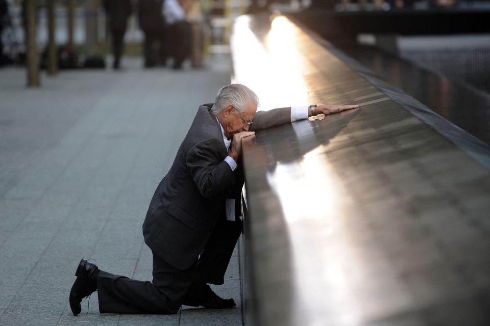<p>Amidst a ceremony marking the 10th anniversary of the World Trade Center attacks, Robert Peraza, who lost his son Robert David Peraza on September 11, pauses at his late son's name at the North Pool of the 9/11 Memorial. </p><p><strong>RELATED: <a href="https://www.redbookmag.com/life/a45910/hillary-oneill-born-911-story/" rel="nofollow noopener" target="_blank" data-ylk="slk:I'm About to Turn 15 Years Old. I Was Born on 9/11.;elm:context_link;itc:0;sec:content-canvas" class="link ">I'm About to Turn 15 Years Old. I Was Born on 9/11.</a></strong></p>