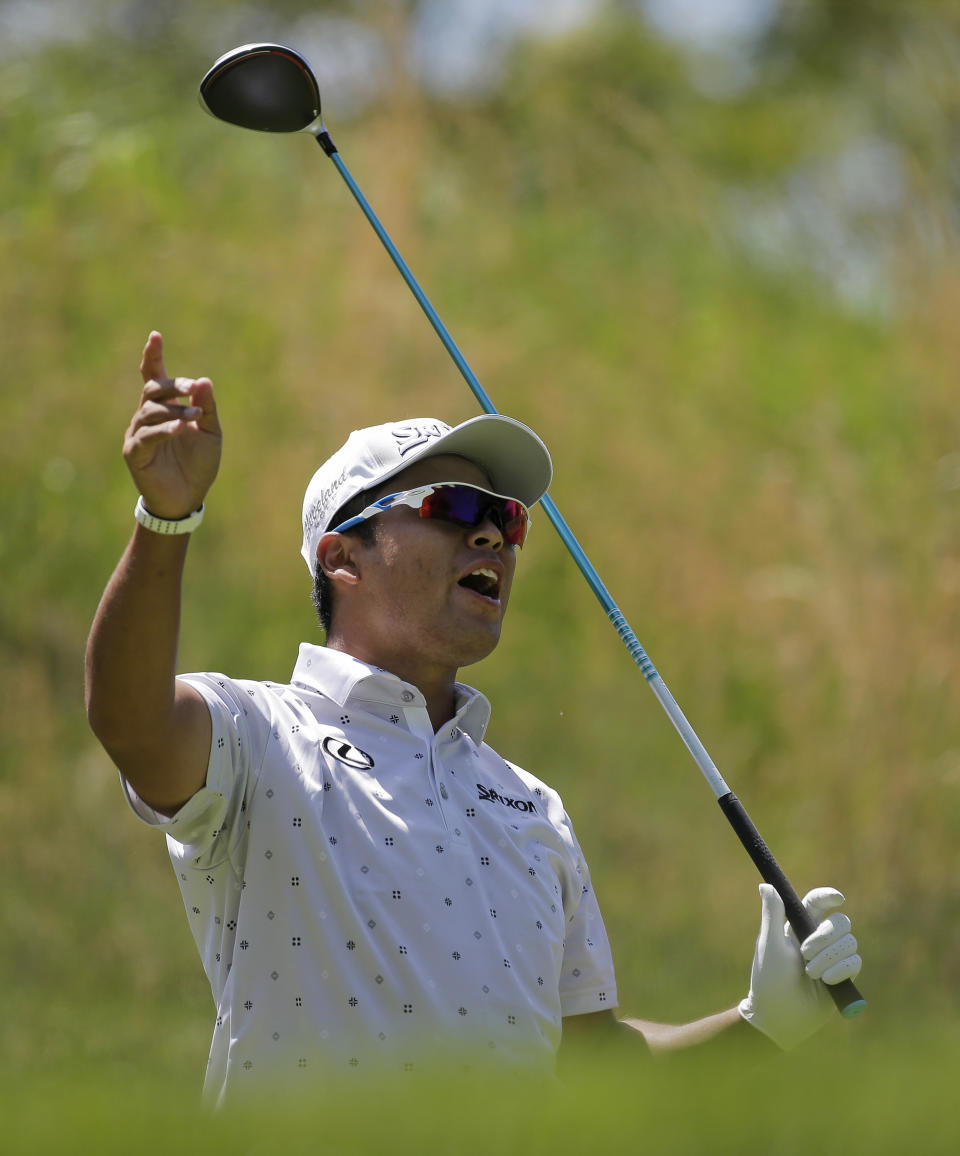 Hideki Matsuyama of Japan calls out on his drive off the fourth tee during the third round of the PGA Championship golf tournament, Saturday, May 18, 2019, at Bethpage Black in Farmingdale, N.Y. (AP Photo/Seth Wenig)