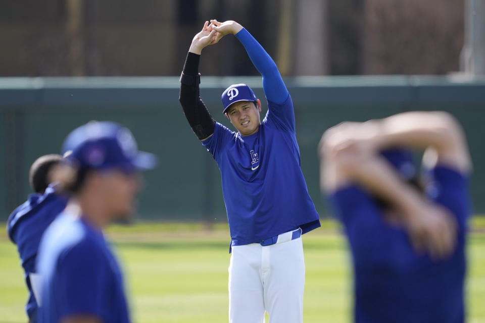 Los Angeles Dodgers designated hitter Shohei Ohtani participates in spring training baseball workouts at Camelback Ranch in Los Angeles, Sunday, Feb. 25, 2024. (AP Photo/Ashley Landis)