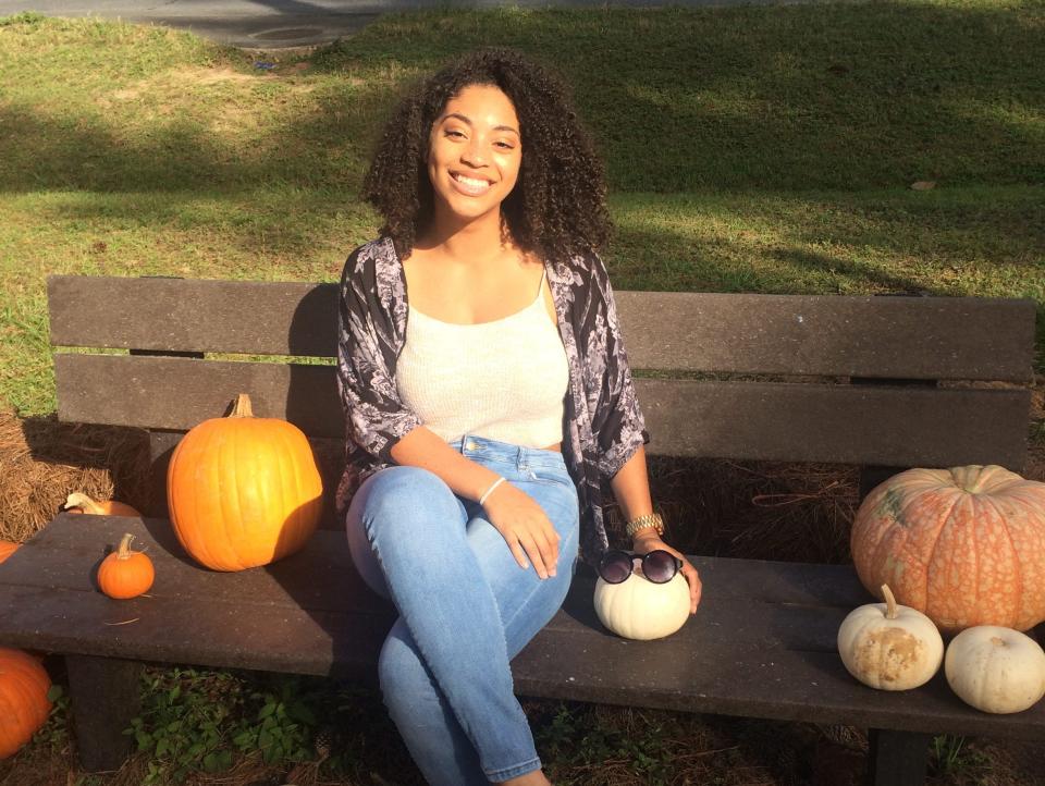 Lauren Edmonds sitting on a bench in Orlando, Florida.