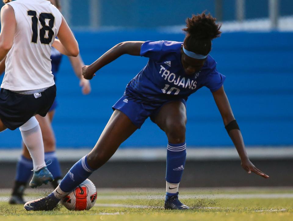Bishop Chatard Brianna Buels (10) steals the ball during the City Tournament match at Bishop Chatard High School, Indianapolis. The Cathedral Fighting Irish defeated the Bishop Chatard Trojans, 3-0. 