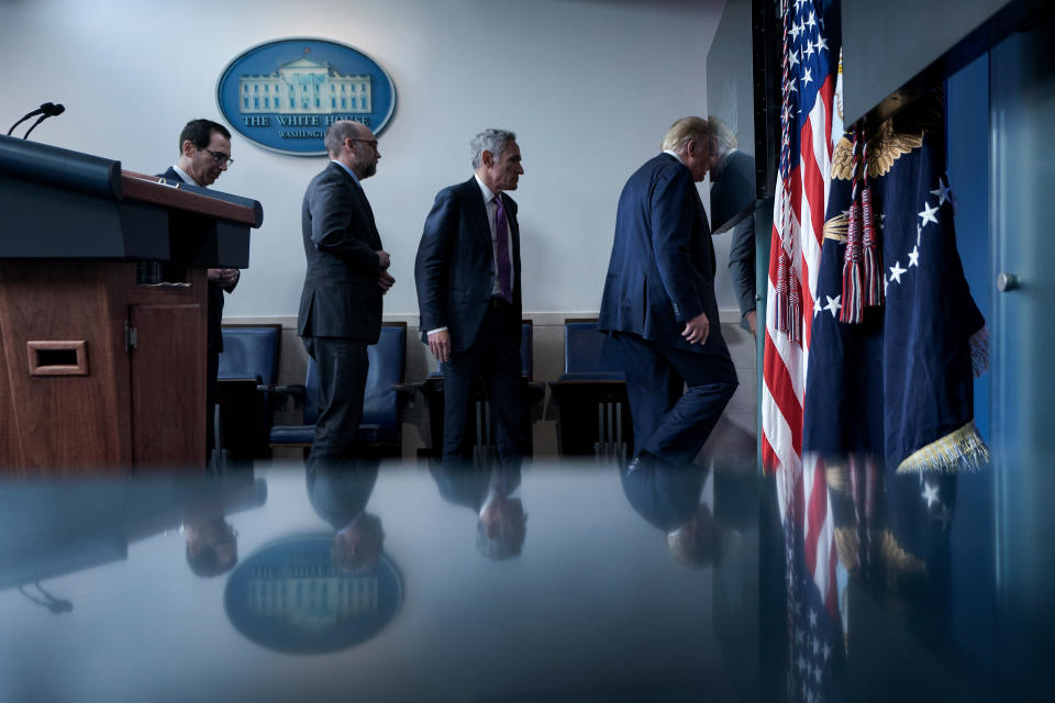 US Secretary of the Treasury Steven Mnuchin, Director of the Office of Management and Budget Russell Vought, member of the coronavirus task force Scott Atlas, and US President Donald Trump leave after a briefing at the White House August 10, 2020, in Washington, DC. - Secret Service guards shot a person, who was apparently armed, outside the White House on Monday, President Donald Trump said just after being briefly evacuated in the middle of a press conference. The president was abruptly ushered out of the press event and black-clad secret service agents with automatic rifles rushed across the lawn north of the White House. Minutes later, Trump reappeared at the press conference, where journalists had been locked in, and announced that someone had been shot outside the White House grounds. Trump said he knew nothing about the identity or motives of the person shot, but when asked if the person had been armed, answered: "From what I understand, the answer is yes." (Photo by Brendan Smialowski / AFP) (Photo by BRENDAN SMIALOWSKI/AFP via Getty Images)