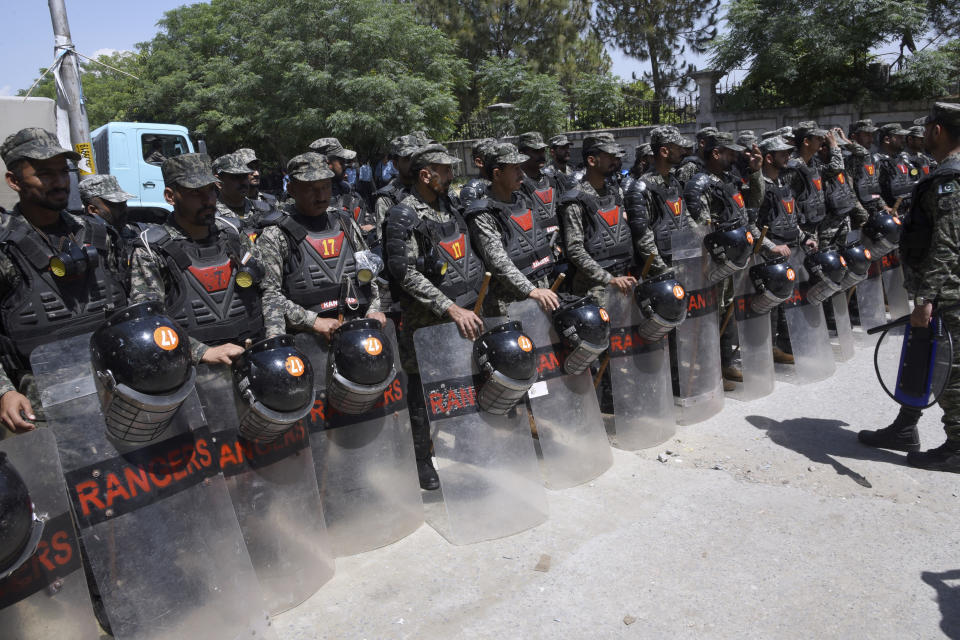 Pakistan's paramilitary troops with riot gear stand guard outside a court, where Pakistan's former Prime Minister Imran Khan appearing, in Islamabad, Pakistan, Tuesday, May 9, 2023. Pakistan's anti-graft agents on Tuesday arrested former Prime Minister Khan as he appeared in a court in the capital, Islamabad, to face charges in multiple graft cases, police and officials from his party said. (AP Photo/Ghulam Farid)