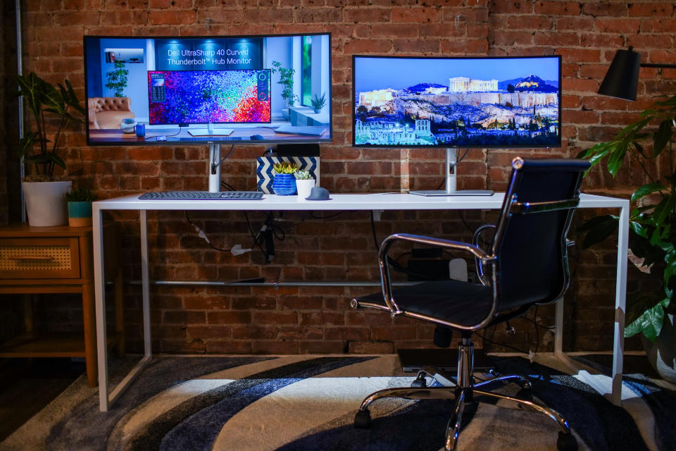 Dell's UltraSharp 40 Curved Thunderbolt Hub Monitor and UltraSharp 34 Curved Thunderbolt Hub Monitor side by side on a desk.