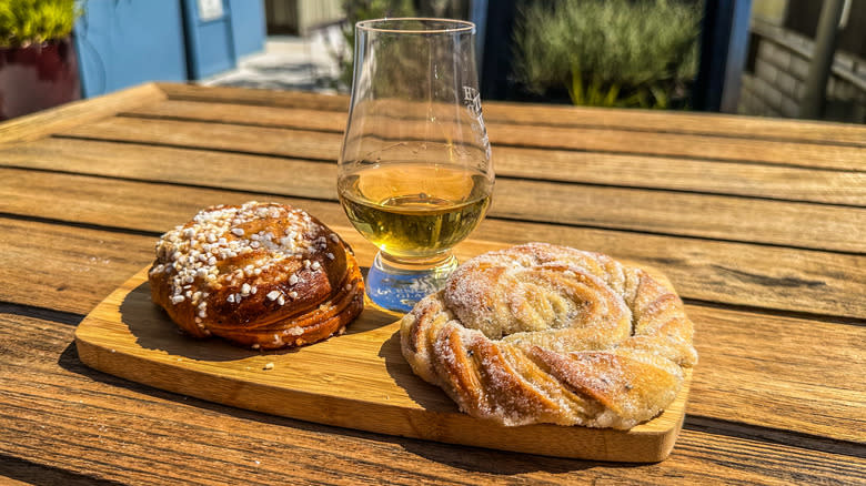 glass of whisky with baked goods