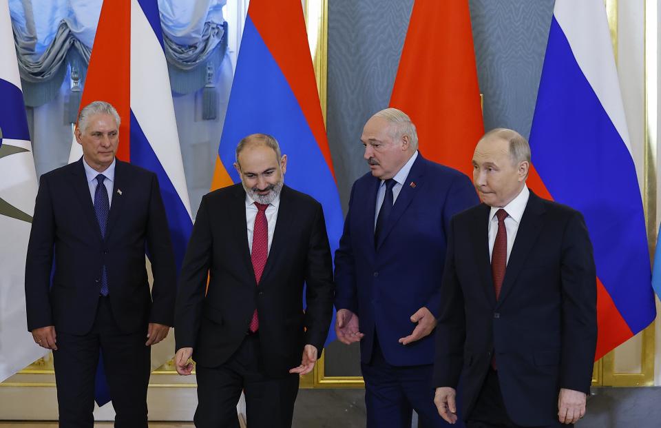 Cuban President Miguel Diaz-Canel, left, Armenian Prime Minister Nikol Pashinyan, second left, Belarusian President Alexander Lukashenko, second right, and Russian President Vladimir Putin pose for a photo during a meeting of the Eurasian Economic Union at the Kremlin in Moscow, Russia, on Wednesday, May 8, 2024. Russian President Vladimir Putin hailed the economic alliance's performance, saying that it helped boost the members' economic potential. (Evgenia Novozhenina/Pool Photo via AP)