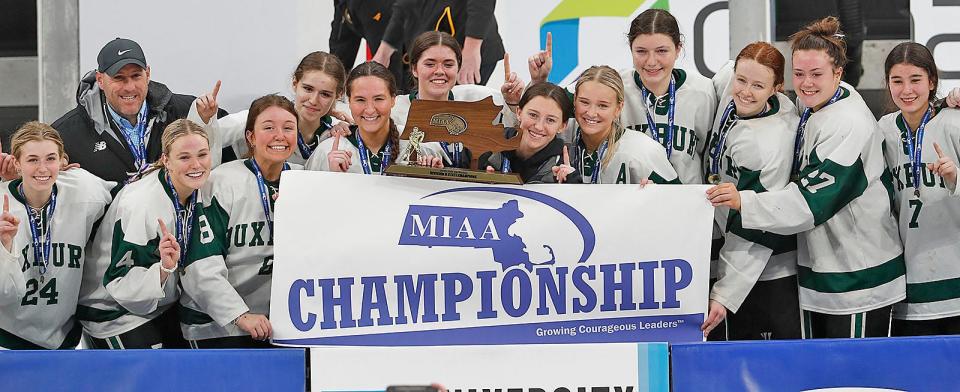 The Duxbury High girls hockey team celebrates their state championship at TD Garden on Sunday after defeating Canton.  Sunday March 19, 2023 