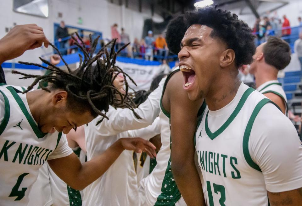 Richwoods' Tavie Smith, left, and Jernell Etherly celebrate the Knight's 56-53 victory over Morton for the Class 3A Limestone Regional basketball title Friday, Feb. 23, 2024 in Bartonville.