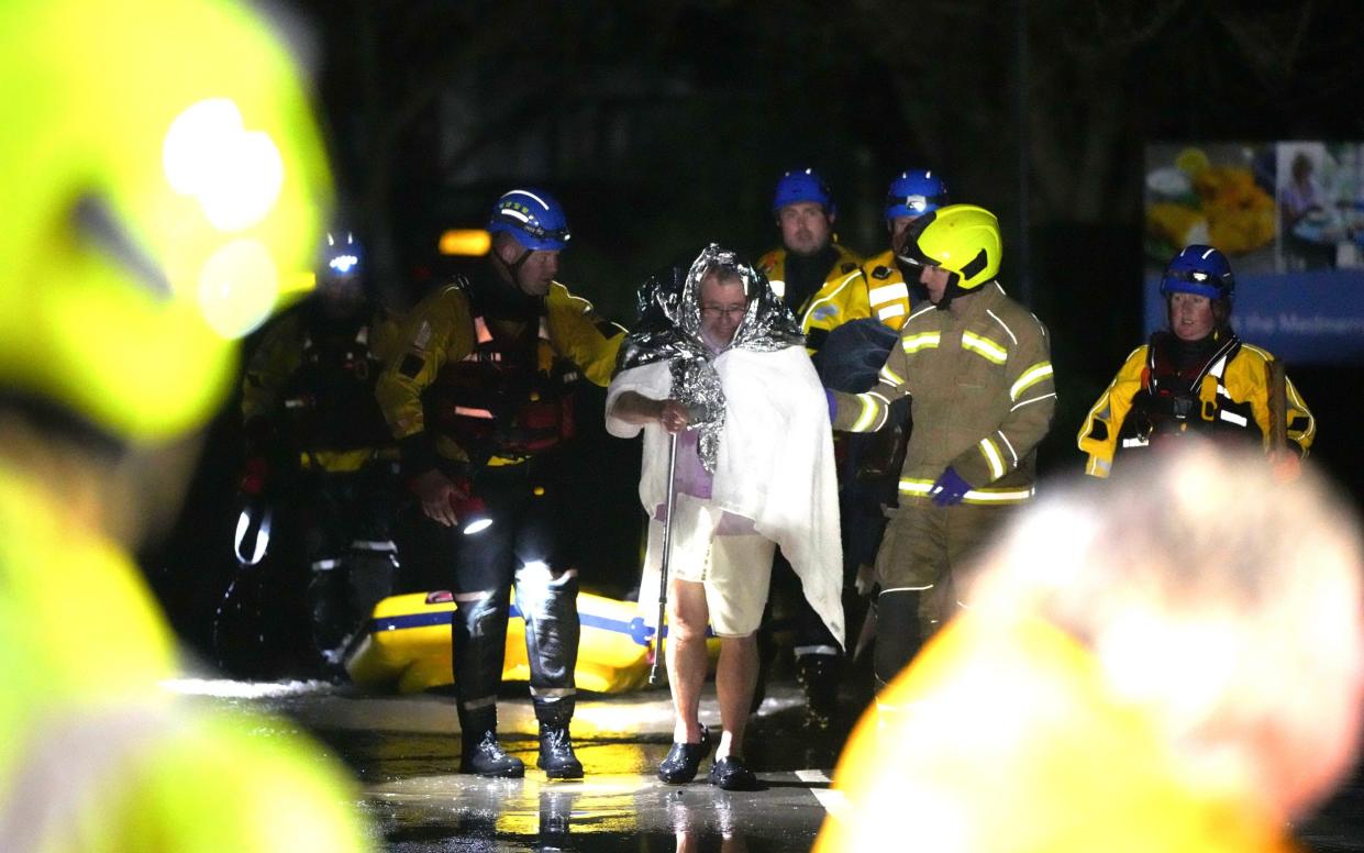 Heavy rain and strong winds continue to batter parts of southern England