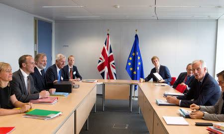 Britain's Secretary of State for Exiting the European Union, Dominic Raab, European Union's chief Brexit negotiator, Michel Barnier and staff members attend a meeting at the EU Commission headquarters in Brussels, Belgium September 6, 2018. Virginia Mayo/Pool via REUTERS