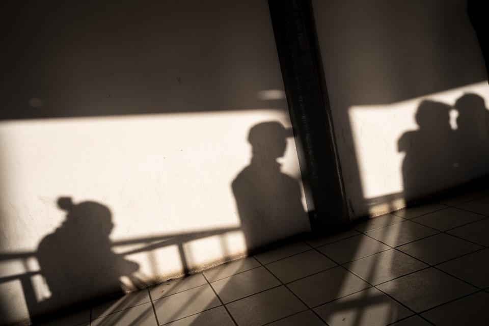 People wait in line to cross the U.S. Customs and Border Protection-Dennis DeConcini Port of Entry into the United States on Dec. 21, 2022, in Nogales, Sonora, Mexico. Title 42 was scheduled to end on Dec. 21, but was given a stay by the U.S. Supreme Court.