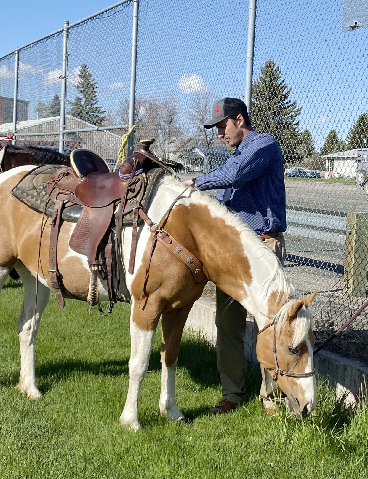 Principal Raymond DeBruycker tended to a horse. (Courtesy Raymond DeBruycker)