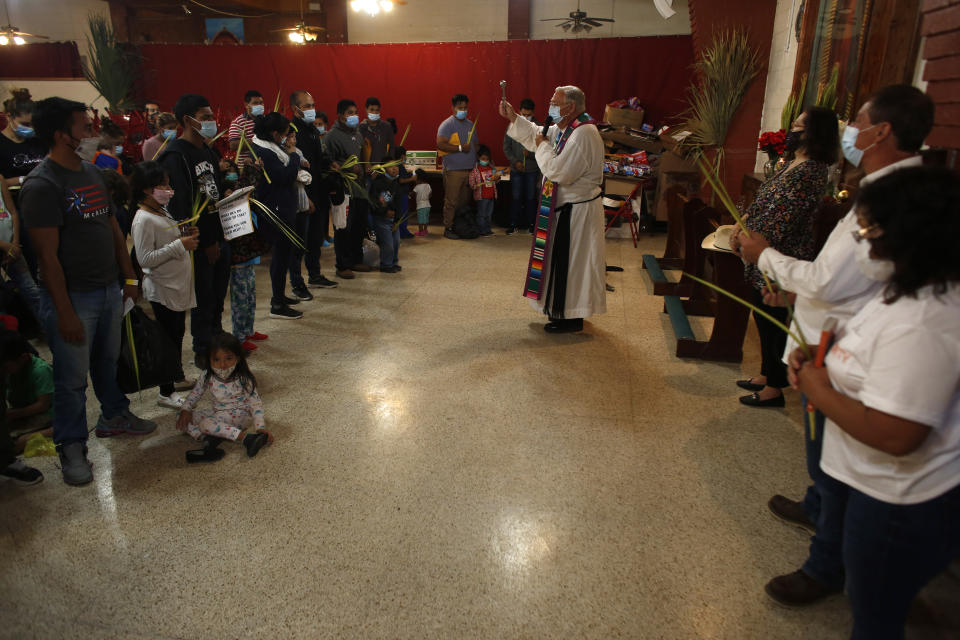 Migrants attend Mass at Our Lady of Guadalupe Catholic Church in McAllen, Texas, on Palm Sunday, March 28, 2021. U.S. authorities are releasing migrant families at the border without notices to appear in immigration court and sometimes, without any paperwork at all. Customs and Border Protection, which oversees the Border Patrol, said it stopped issuing court notices in some cases because preparing even one of the documents often takes hours. Migrants undergo background checks and are tested for COVID-19. (AP Photo/Dario Lopez-Mills)
