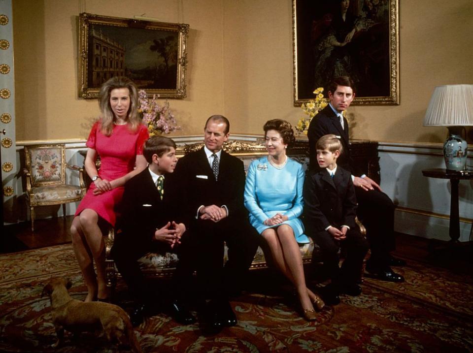 <p>Posing next to Prince Andrew, Prince Philip, Queen Elizabeth, Prince Edward, and Prince Charles for a portrait at Buckingham Palace.</p>