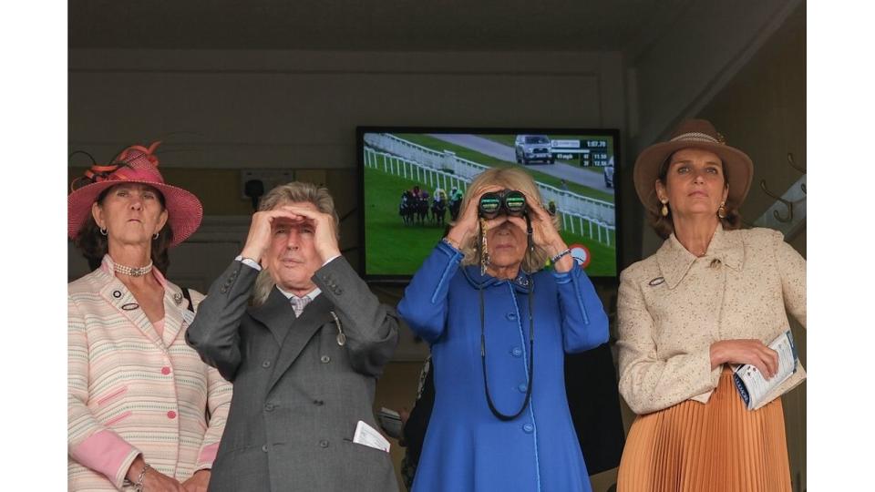 Camilla used her binoculars to get a better look at the races