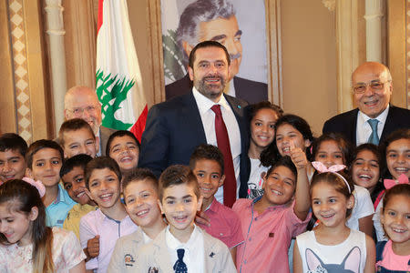 Lebanon's outgoing Prime Minister Saad al-Hariri meets Islamic orphans in Beirut, Lebanon May 23, 2018. REUTERS/Dalati Nohra/Handout via REUTERS
