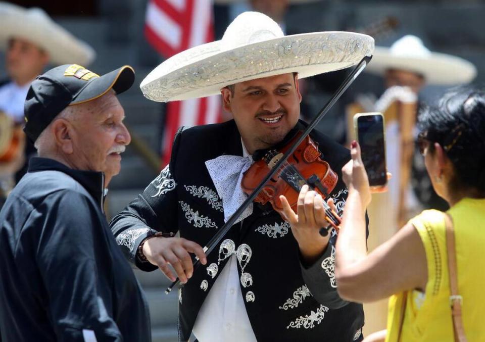 A Mariachi Juvenil Colotlán violinist poses for a photo during the Memorial Day ceremony at Courthouse Park in Madera on May 29, 2023.