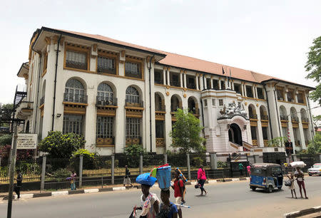 People walk past Sierra Leone's high court in Freetown, Sierra Leone March 24, 2018. REUTERS/Umaru Fofana