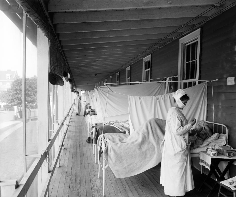 A nurse checking on a patient at the Walter Reed Hospital Flu Ward in Washington during the influenza pandemic of 1918. (Photo: Harris & Ewing/Underwood Archives/Getty Images)