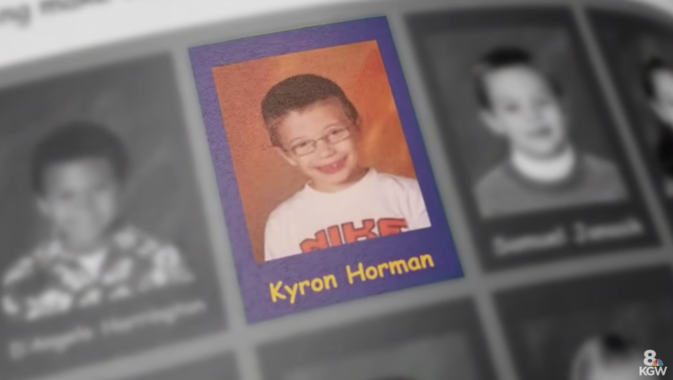 Kyron's school photo where he has a shirt and glasses