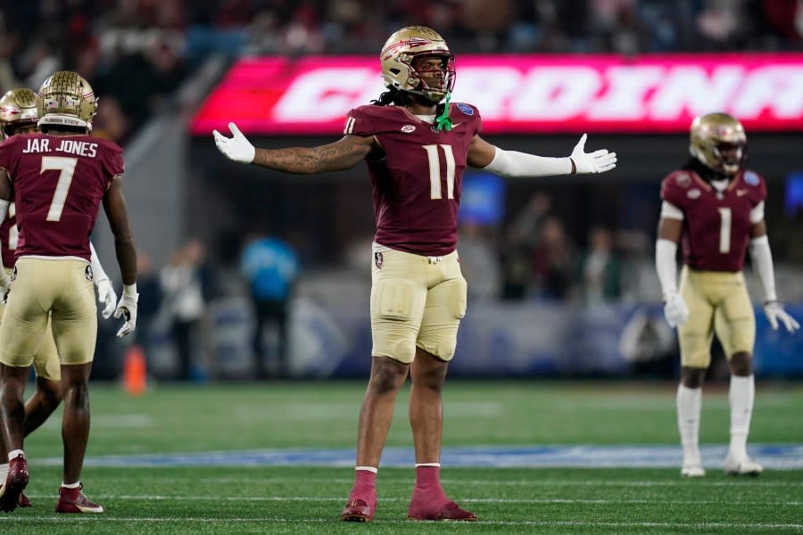 Florida State defensive lineman Patrick Payton reacts after a play during the second half of the team’s Atlantic Coast Conference championship NCAA college football game against Louisville, Saturday, Dec. 2, 2023, in Charlotte, N.C. (AP Photo/Erik Verduzco)