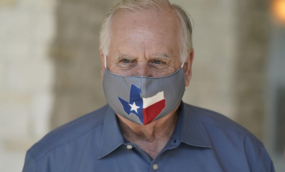 A member of Prestonwood Baptist Church wears a Texas themed mask at the church Sunday, Oct. 11, 2020, in Plano, Texas. Three weeks before the U.S. presidential election, an evangelical church in a Dallas suburb has emerged as a front for Republicans fighting to keep the diversifying state from flipping to Democratic presidential candidate Joe Biden. (AP Photo/LM Otero)