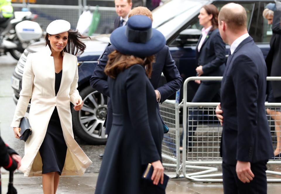 Meghan Markle makes her way into the service behind Prince William, the Duke of Cambridge, and his wife, Catherine, Duchess of Cambridge. (Photo: DANIEL LEAL-OLIVAS via Getty Images)