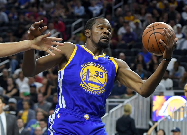 Kevin Durant of the Golden State Warriors grabs a rebound against the Los Angeles Lakers during their pre-season game at T-Mobile Arena in Las Vegas, Nevada, on October 15, 2016