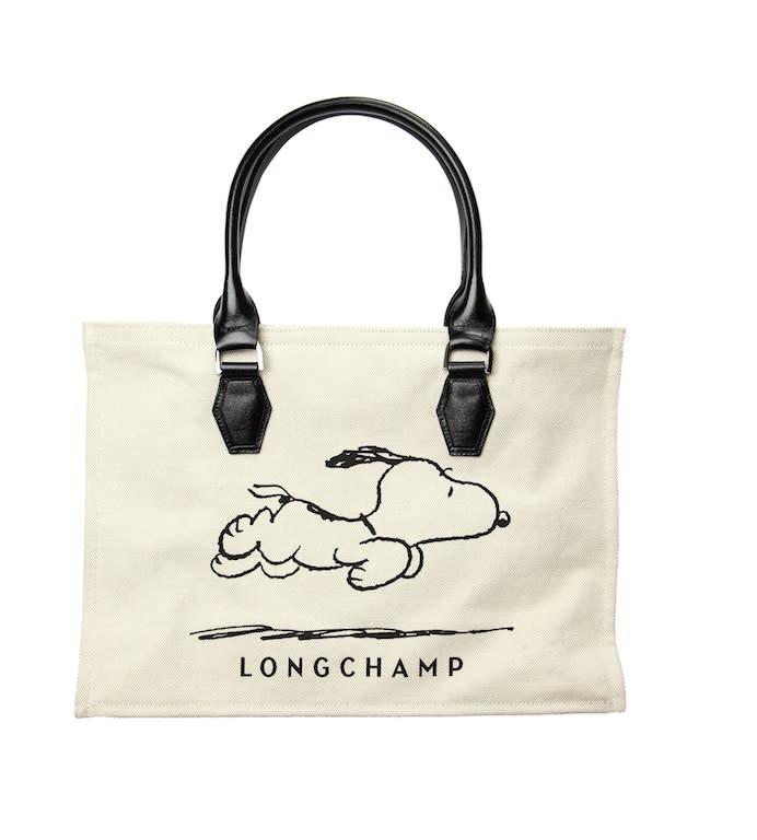 <p>To celebrate ‘Peanuts’’ 60th anniversary back in 2010, the bag designer created several accessories with the loveable Snoopy emblazoned on them.<em> [Photo: Longchamp]</em> </p>