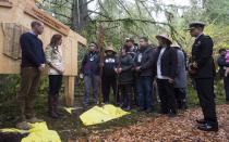 The Duke and Duchess of Cambridge listen to First Nations members before being presented with paddles following a plaque unveiling in the Great Bear rainforest in Bella Bella, B.C., Monday, Sept 26, 2016. THE CANADIAN PRESS/Jonathan Hayward