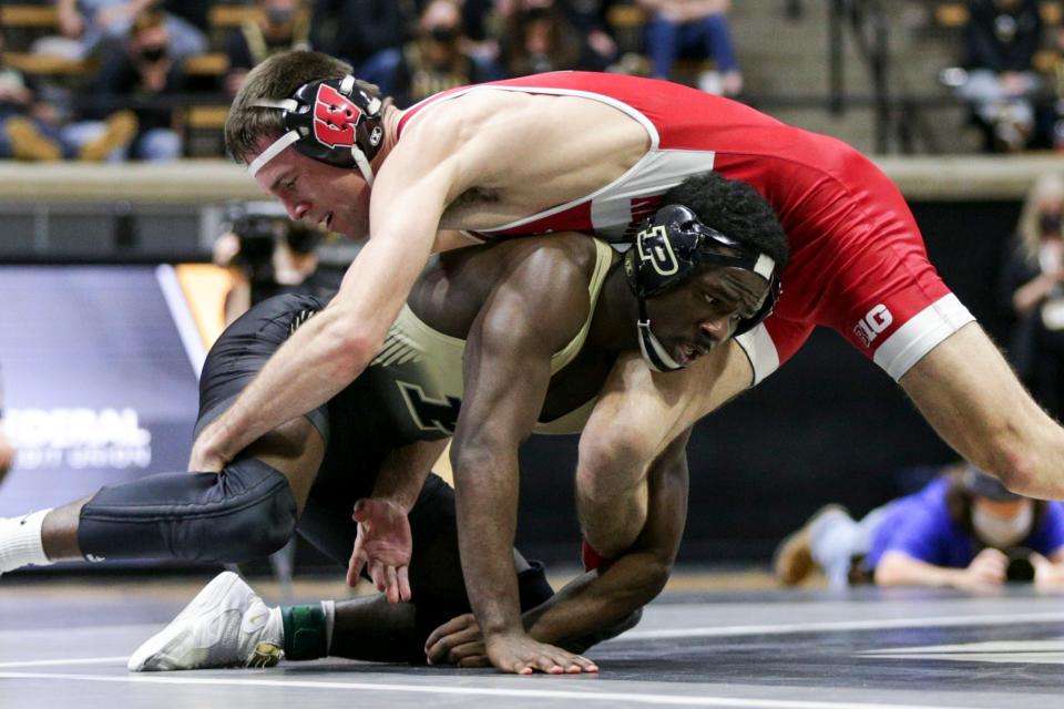 Purdue’s Kendall Coleman wrestles Wisconsin’s Garrett Model during a 157pound bout in a Big Ten Duals wrestling match, Sunday, Jan. 23, 2022 at Mackey Arena in West Lafayette.