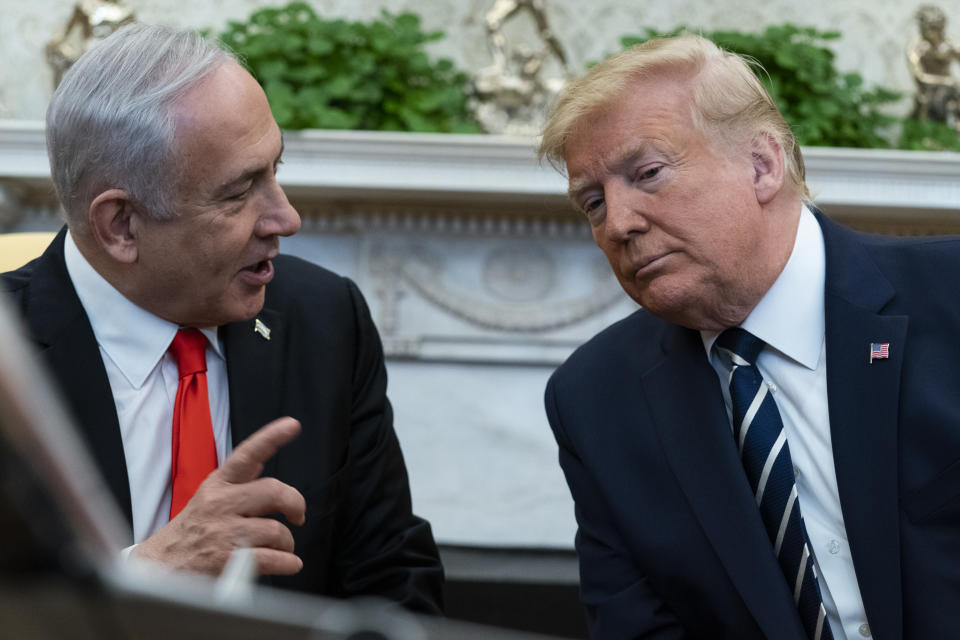 President Donald Trump listens to Israeli Prime Minister Benjamin Netanyahu during a meeting in the Oval Office of the White House, Monday, Jan. 27, 2020, in Washington. (AP Photo/ Evan Vucci)