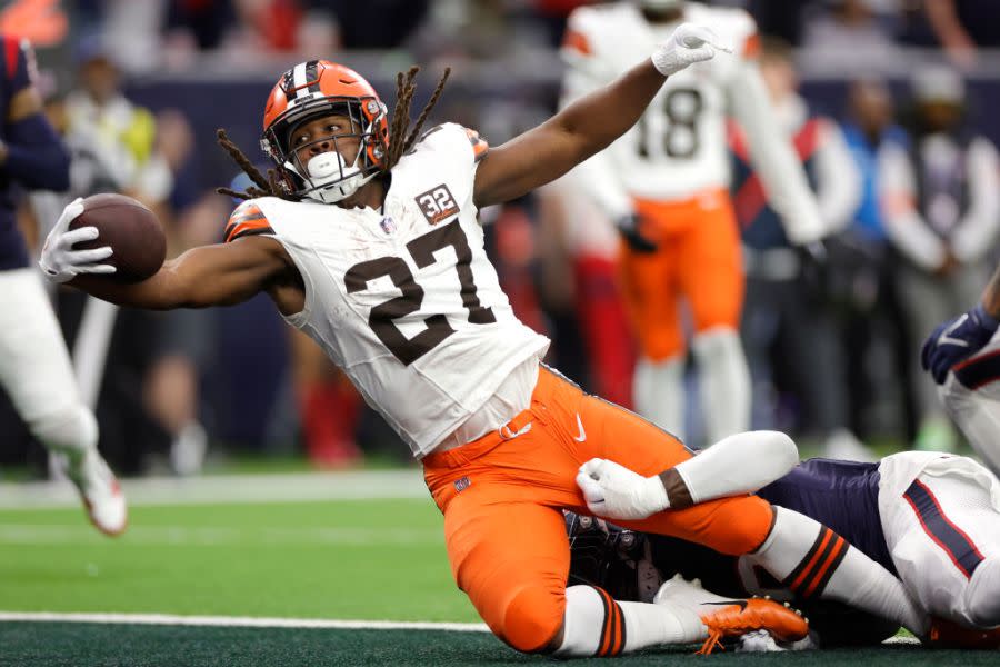 HOUSTON, TEXAS – JANUARY 13: Kareem Hunt #27 of the Cleveland Browns scores an 11 yard touchdown against the Houston Texans during the second quarter in the AFC Wild Card Playoffs at NRG Stadium on January 13, 2024 in Houston, Texas. (Photo by Carmen Mandato/Getty Images)