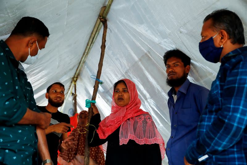 The Wider Image: 'Can't take this pain': Rohingya mother searches for son after refugee camp blaze