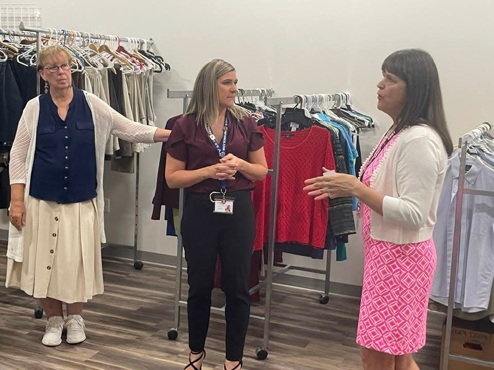 Veterans' Rally Point Director of Military Services Lori Marriot (right) tells State Senator Cathy Osten and Rally Point Food Coordinator Tammy Stott that it'd be possible to move clothing donations to expand the pantry further.