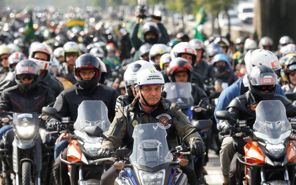 Jair Bolsonaro, front, during a motorcycle tour with his followers in Sao Paulo - Alan Santos/Presidency of Brazil/HANDOUT/EPA-EFE/Shutterstock