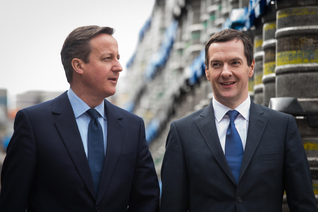 WOLVERHAMPTON, ENGLAND - APRIL 1:  British Prime Minister and Conservative party leader David Cameron (L) and British Finance Minister George Osborne visit the Marston's Brewery on April 1, 2015 in Wolverhampton, England. The visit was part of the Conservative Party's campaign, in the run-up to the general election on May 7. (Photo by Leon Neal - WPA Pool/Getty Images)