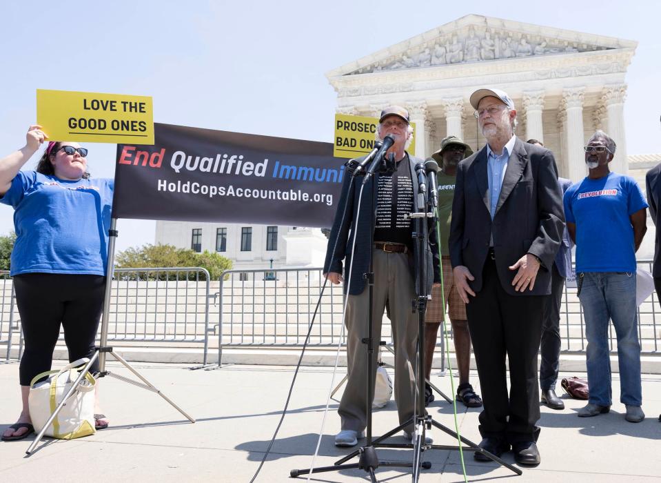 Ben & Jerry's co-founders Ben Cohen, front right, and Jerry Greenfield speak on police reform at the U.S. Supreme Court in 2021.