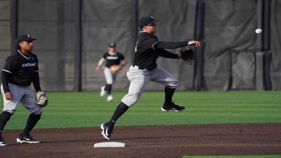 UC second baseman Lauden Brooks turns two for the Bearcats. Brooks played in high school at McNicholas.