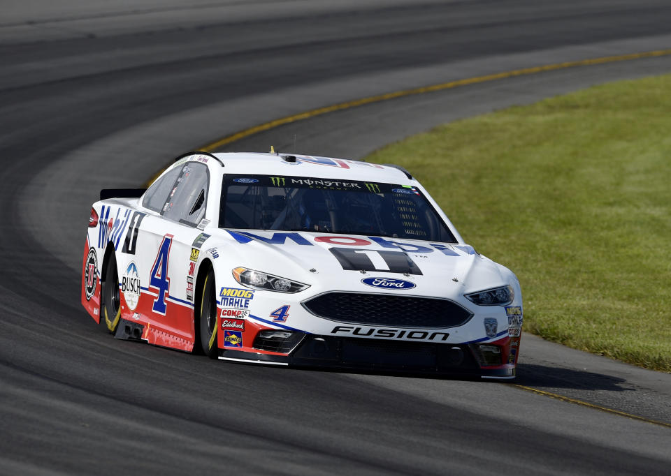 Kevin Harvick drives through Turn 3 during qualifying for Sunday's NASCAR Cup Series auto race, Saturday, July 28, 2018, in Long Pond, Pa. Harvick qualified on the pole, but his car failed post-qualifying inspection, and he will start at the rear of the field. (AP Photo/Derik Hamilton)