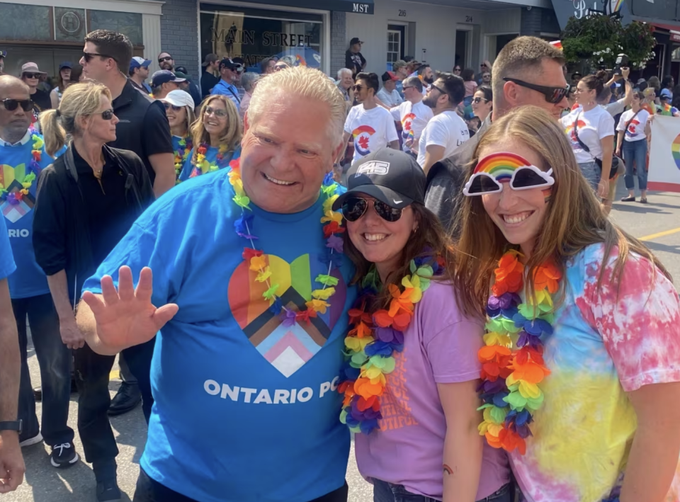 Ontario Premier Doug Ford poses for photos as he attends the York Pride Parade in Newmarket, Ont., on Saturday June 17, 2023. CSIS warns that 'anti-2SLGBTQl+ narratives remain a common theme in violent rhetoric' online. (The Canadian Press)