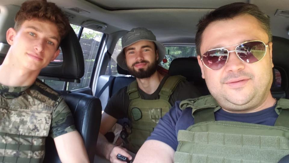 Mr Yakushev, pictured with two others delivering aid to Ukraine, has lost several family members to the war (Yevgen Yakushev)