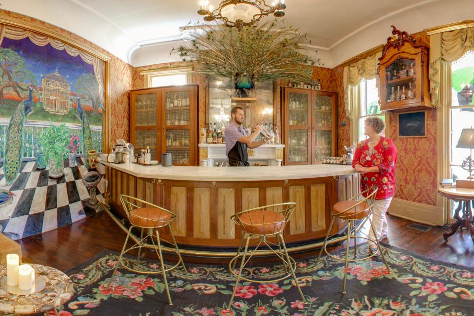 Liz Creel and bartender William King at Creel's Park View Historic Hotel in New Orleans.