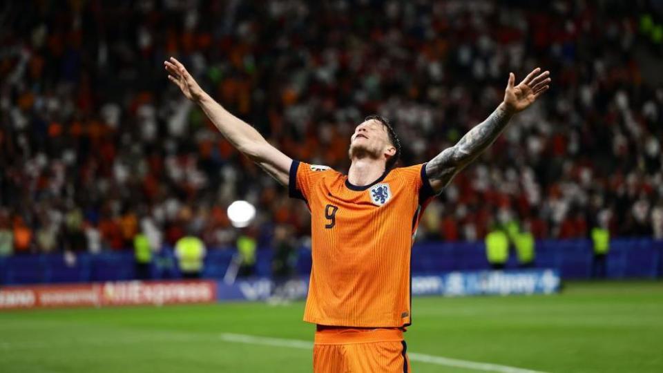 Wout Weghorst celebrates as the Netherlands beats Turkey