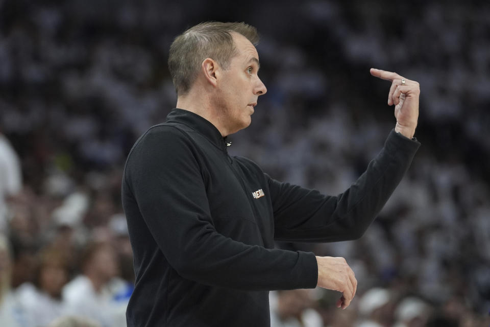 Phoenix Suns head coach Frank Vogel signals during the first half of Game 1 of an NBA basketball first-round playoff series against the Minnesota Timberwolves, Saturday, April 20, 2024, in Minneapolis. (AP Photo/Abbie Parr)
