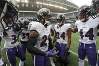 Baltimore Ravens free safety Earl Thomas (29) center, talks to teammates, including cornerbacks Marcus Peters (24) and Marlon Humphrey (44), in a huddle before an NFL football game against the Seattle Seahawks, Sunday, Oct. 20, 2019, in Seattle. (AP Photo/Elaine Thompson)