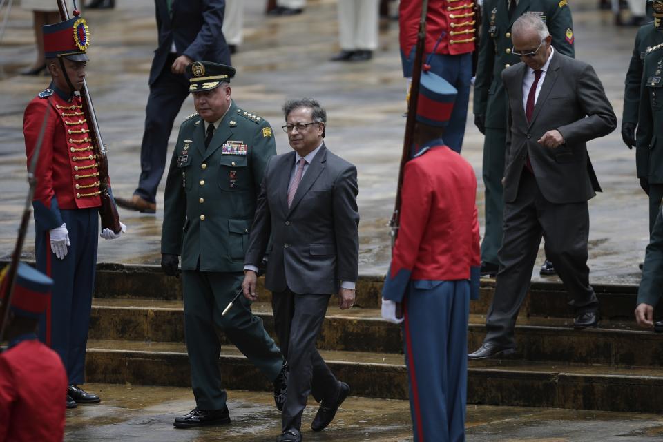 Colombian President Gustavo Petro, second left, attends a ceremony commemorating the battle of Boyaca that sealed Colombia's independence from Spain, in Puente de Boyaca, Colombia, Monday, Aug. 7, 2023. Petro is marking his first year in office, days after his son was charged for alleged illicit enrichment and money laundering in connection with his 2022 campaign funding. (AP Photo/Ivan Valencia)