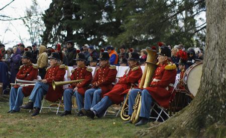 Members of President Lincoln's Own Band from Kentucky listen to speeches at the Gettysburg National Cemetery in Pennsylvania November 19, 2013, the burial ground for Civil War Union soldiers in which U.S. President Abraham Lincoln travelled to in 1863 to deliver a few concluding remarks at a formal dedication. REUTERS/Gary Cameron