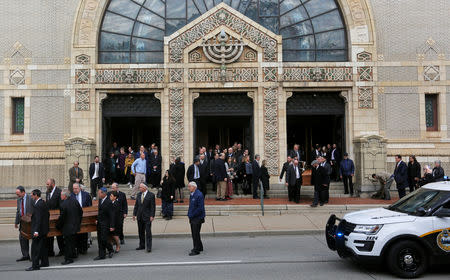 The caskets are carried from Rodef Shalom Temple after funeral services for brothers Cecil and David Rosenthal, victims of the Tree of Life Synagogue shooting, in Pittsburgh, Pennsylvania, U.S., October 30, 2018. REUTERS/Cathal McNaughton